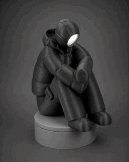 sad-man figurine + illuminated face