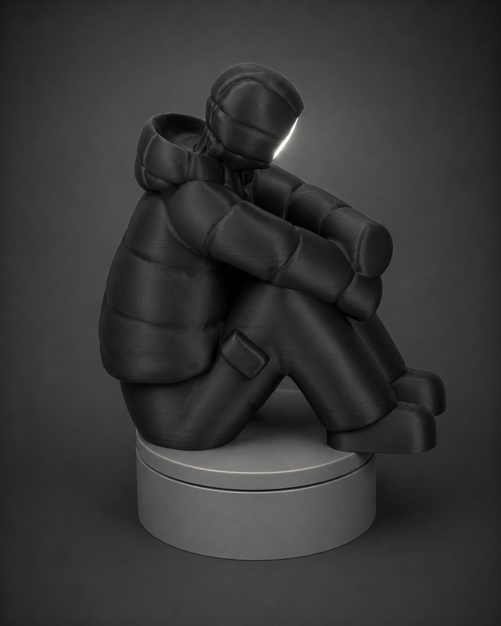 sad-man figurine + illuminated face