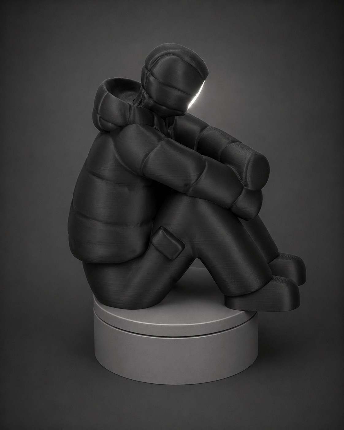 sad-man figurine + illuminated face