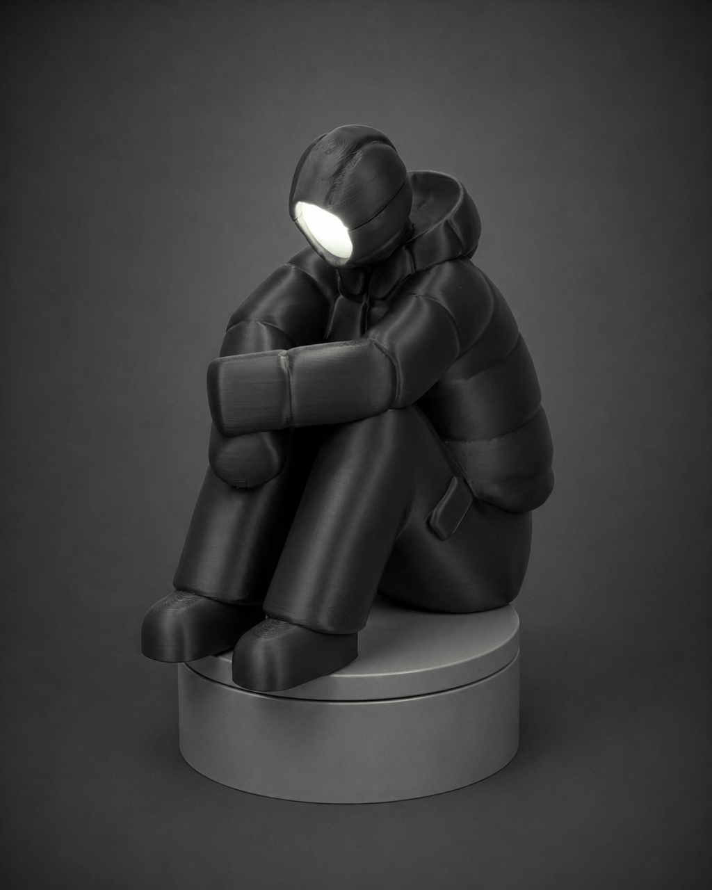 sad-man figurine + illuminated face