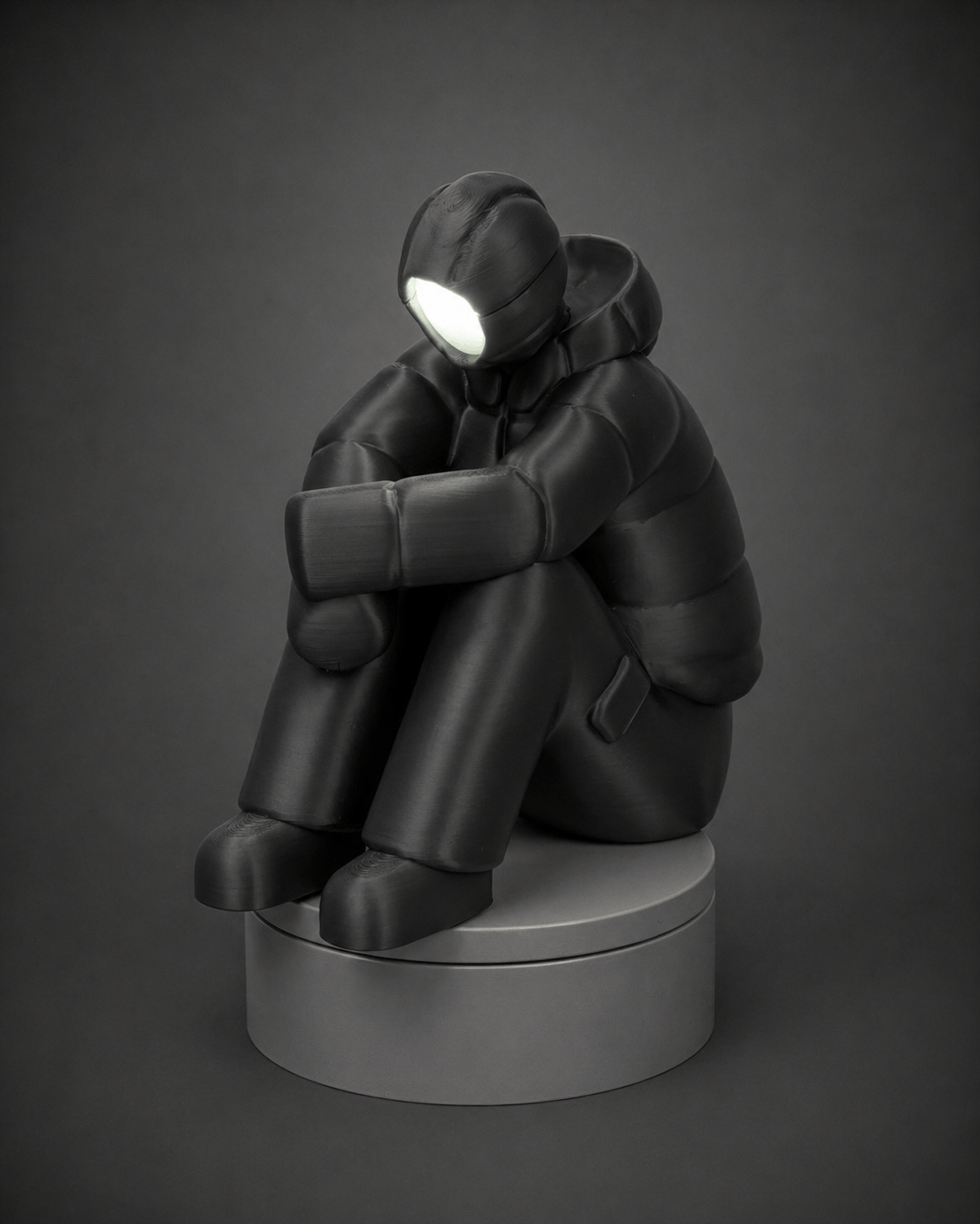 sad-man figurine + illuminated face
