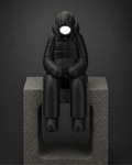 sitting-ledge figurine + illuminated face