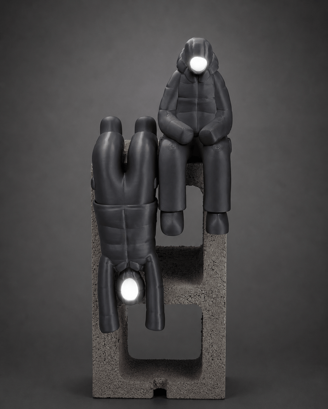 dangling-ledge figurine + illuminated face